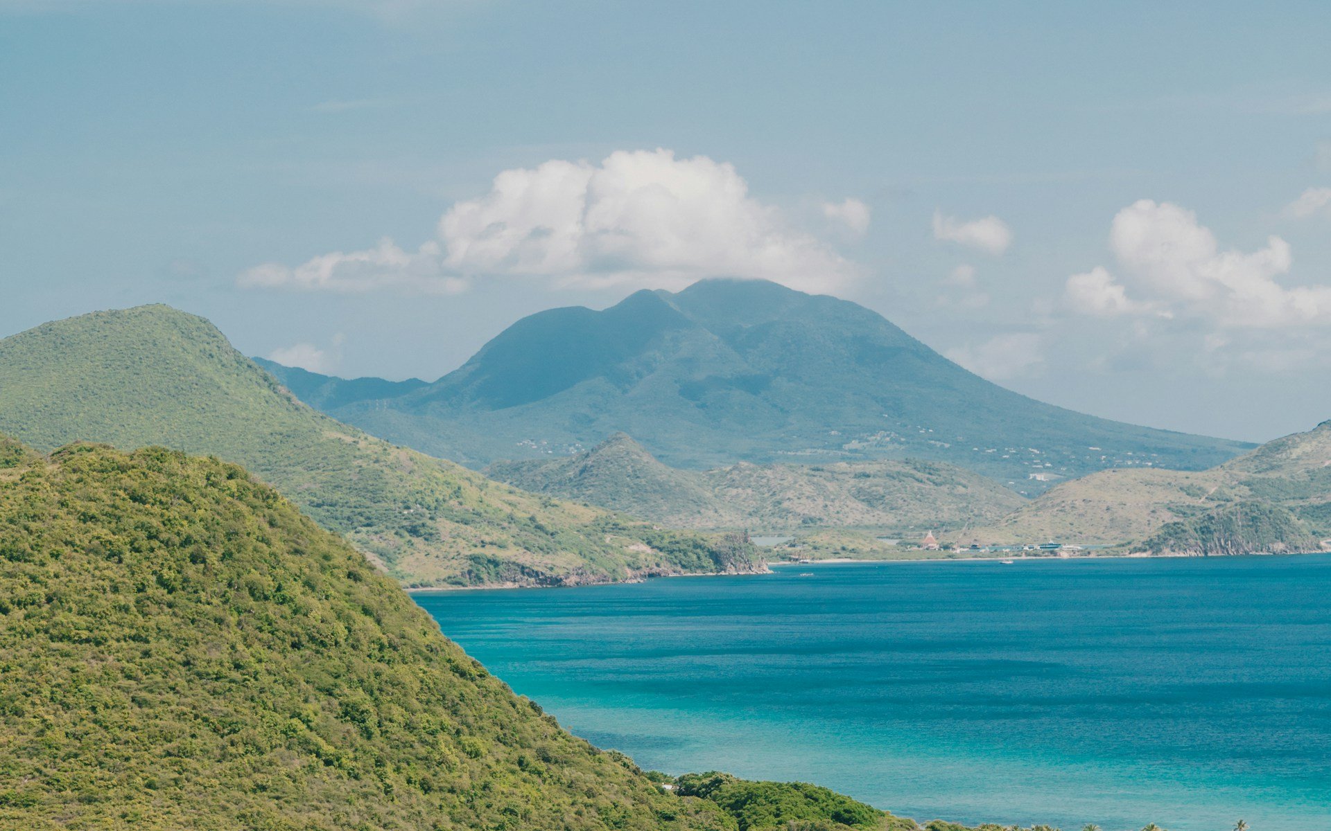 Coastline of St Kitts with Nevis Peak visible in the distance
