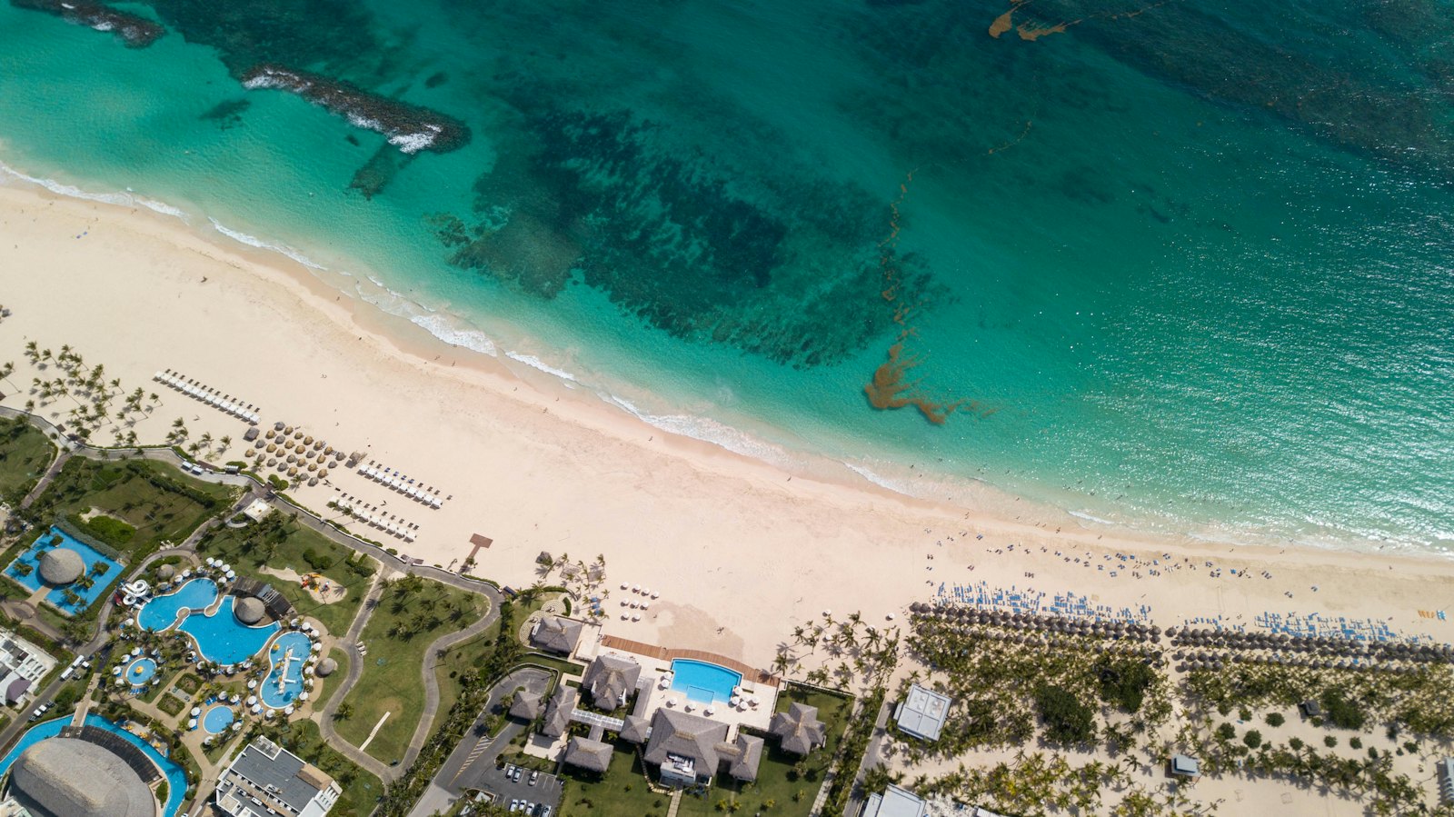Aerial view of beachfront resorts along the Punta Cana coastline