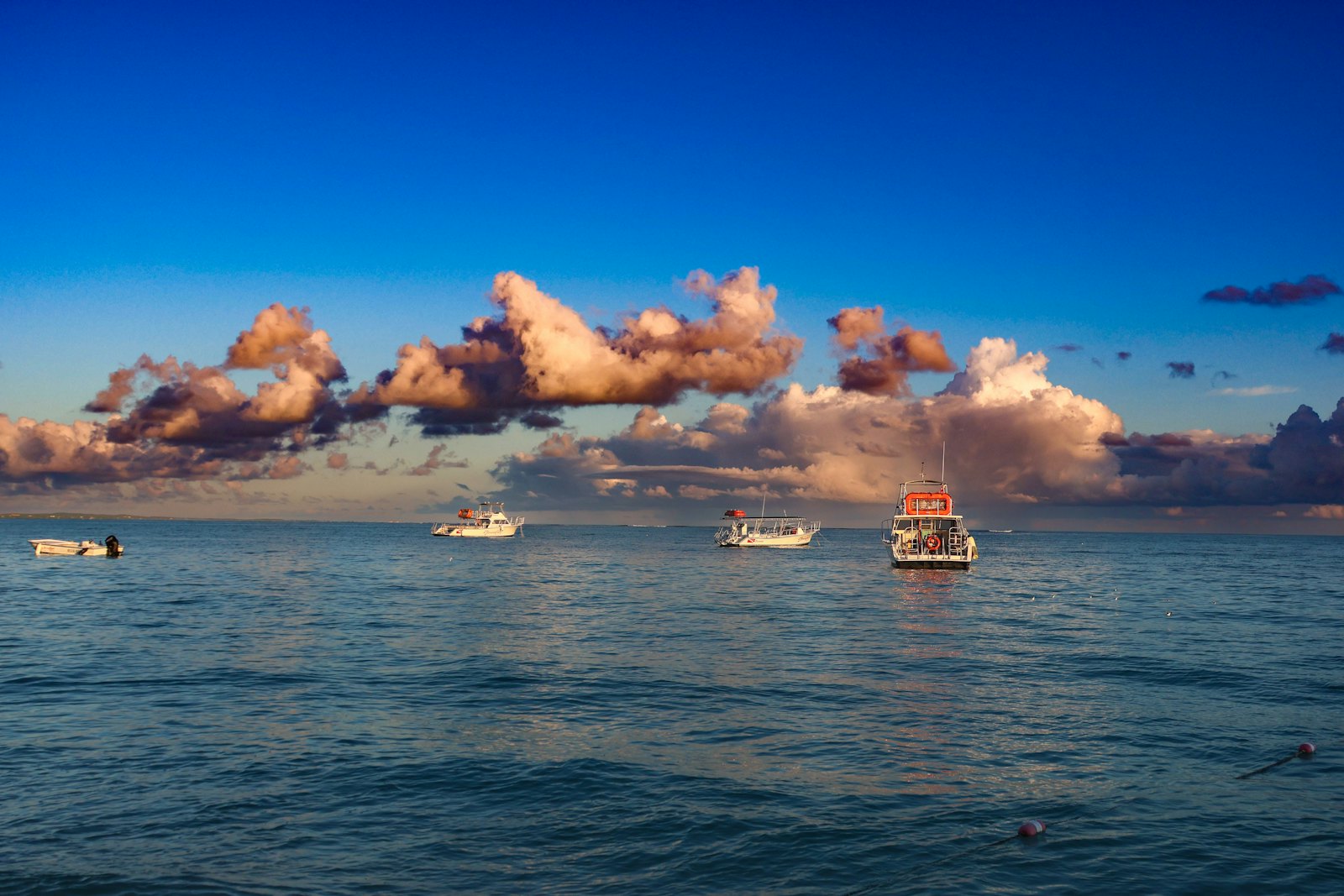 Boats at sunset off The Bight, Providenciales, Turks and Caicos