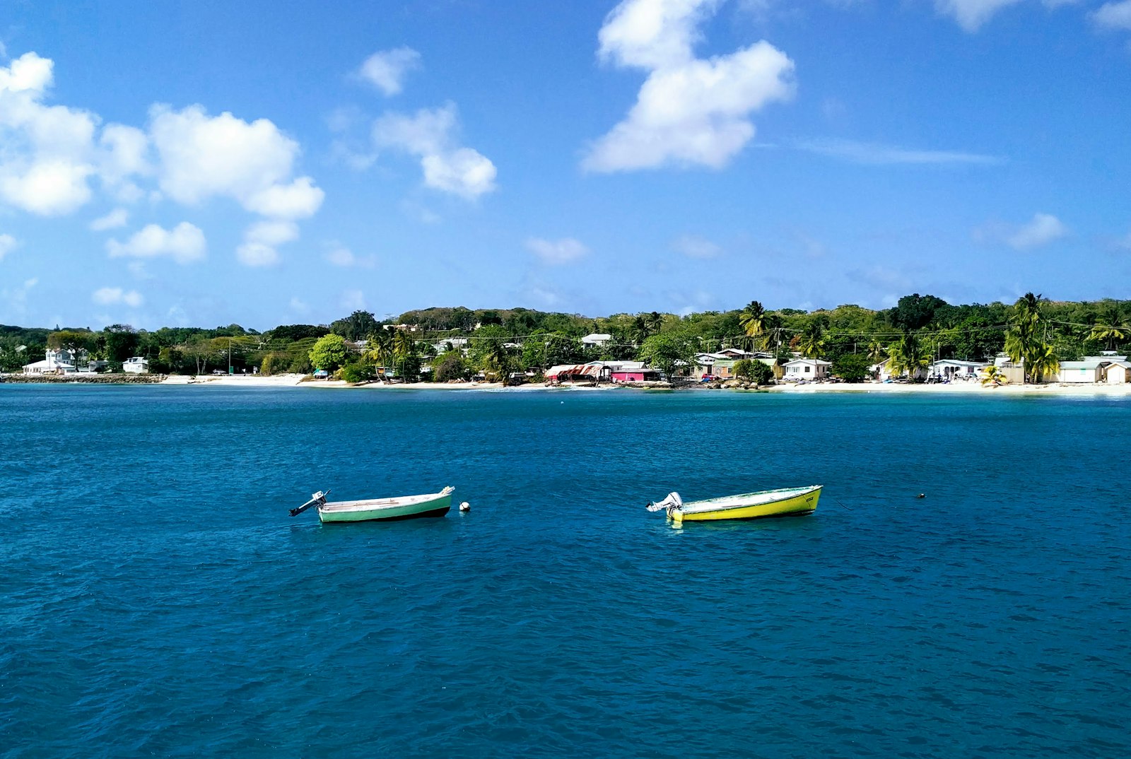 Boats moored in calm water off the west coast of Barbados