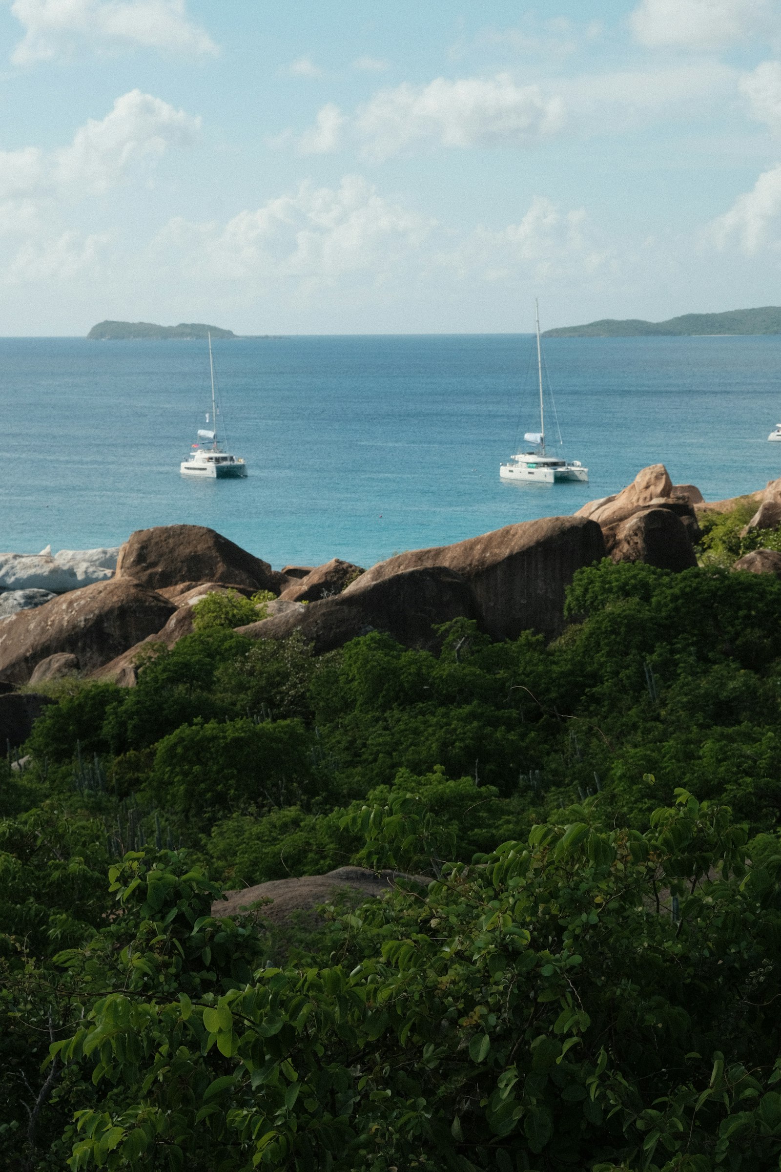 Yachts moored off the rocky coast of Virgin Gorda, British Virgin Islands
