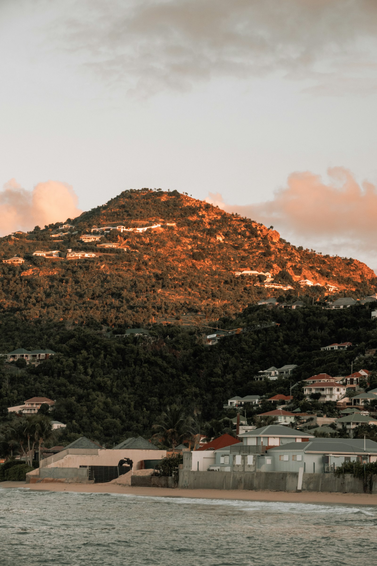 Hillside villas lit by the evening sun above Lorient, St Barthelemy
