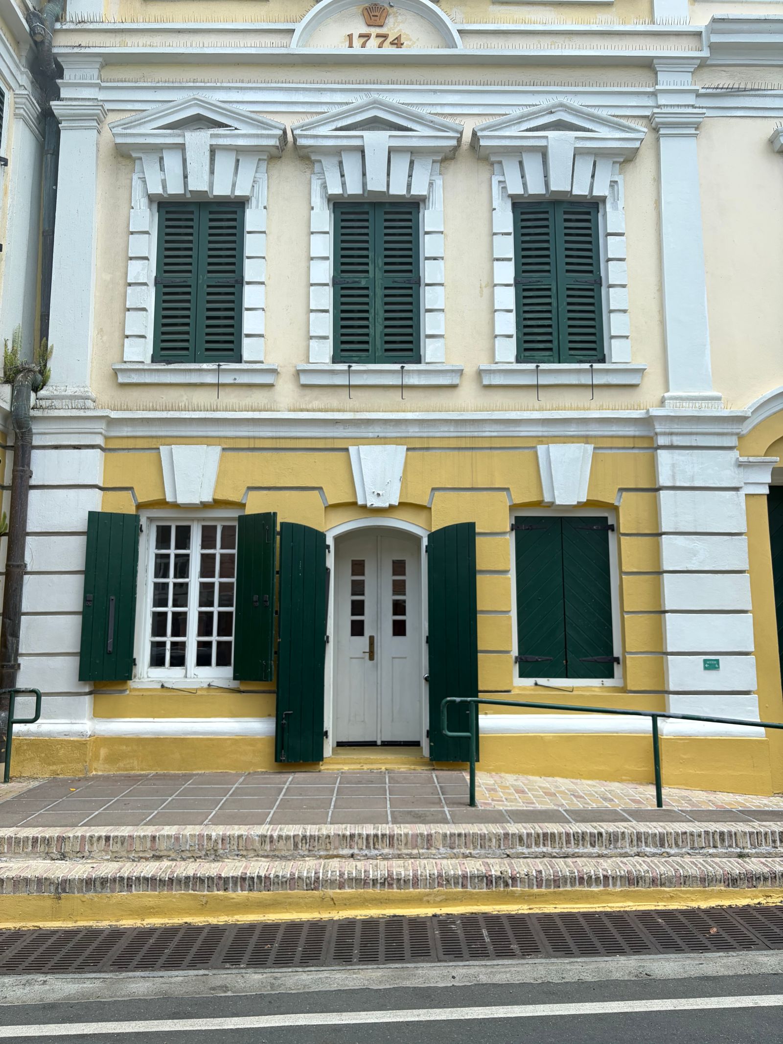 Historic colonial building with green shutters, St Croix