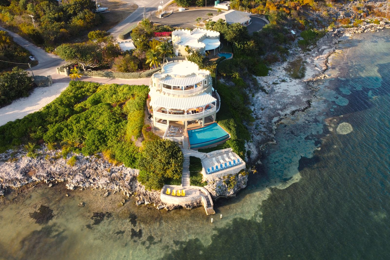 Aerial view of a beachfront villa with a seafront pool, Grand Cayman